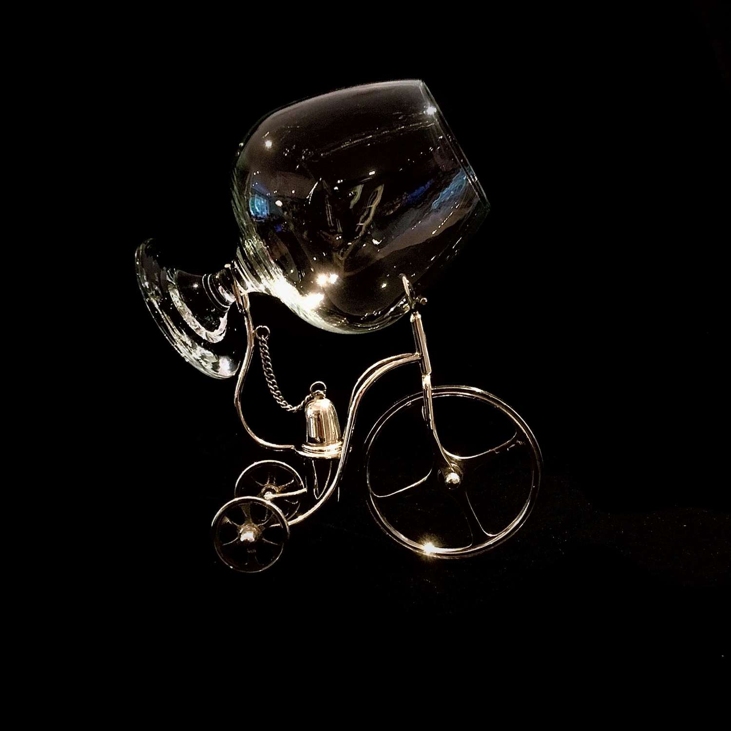 Unusual silver plated brandy warmer in the shape of a tricycle