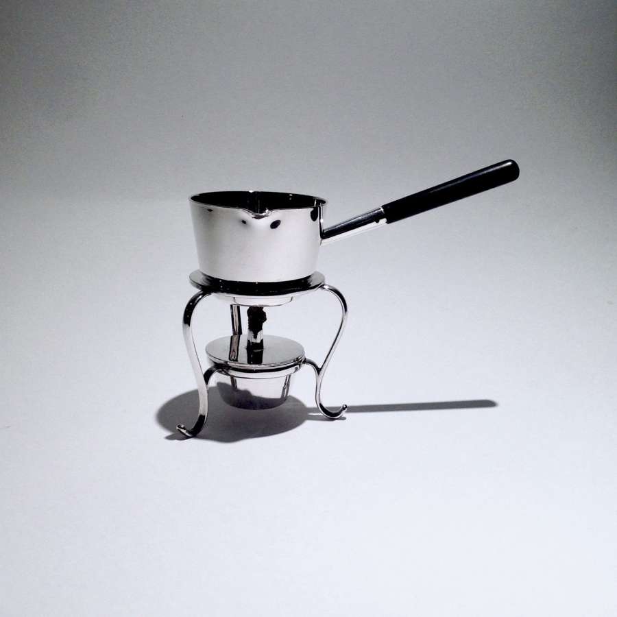 A charming small silver plated, pan shaped spirit or brandy warmer