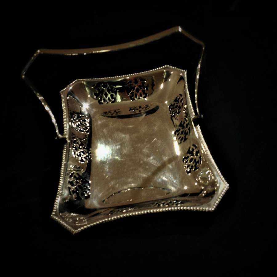 Decorative silver plated swing-handled basket