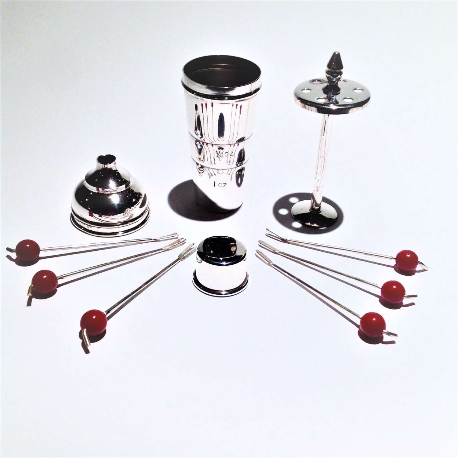 Silver-plated miniature cocktail shaker shape measure containing picks