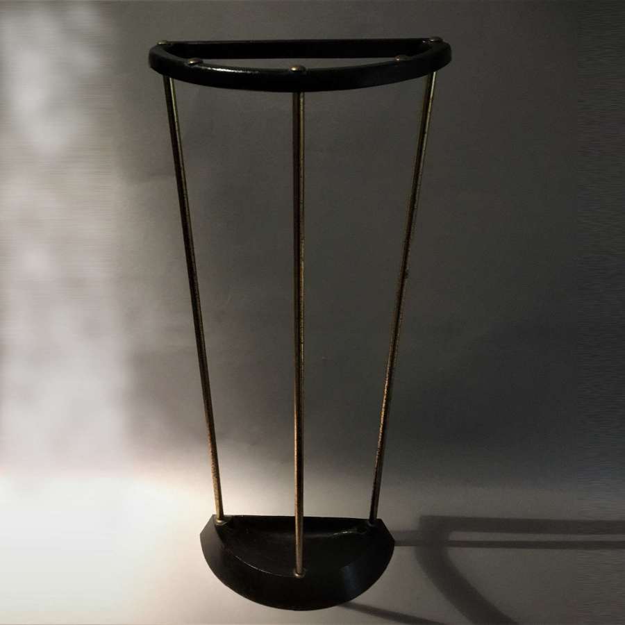 A good mid-century modern demi-lune walking stick or umbrella stand