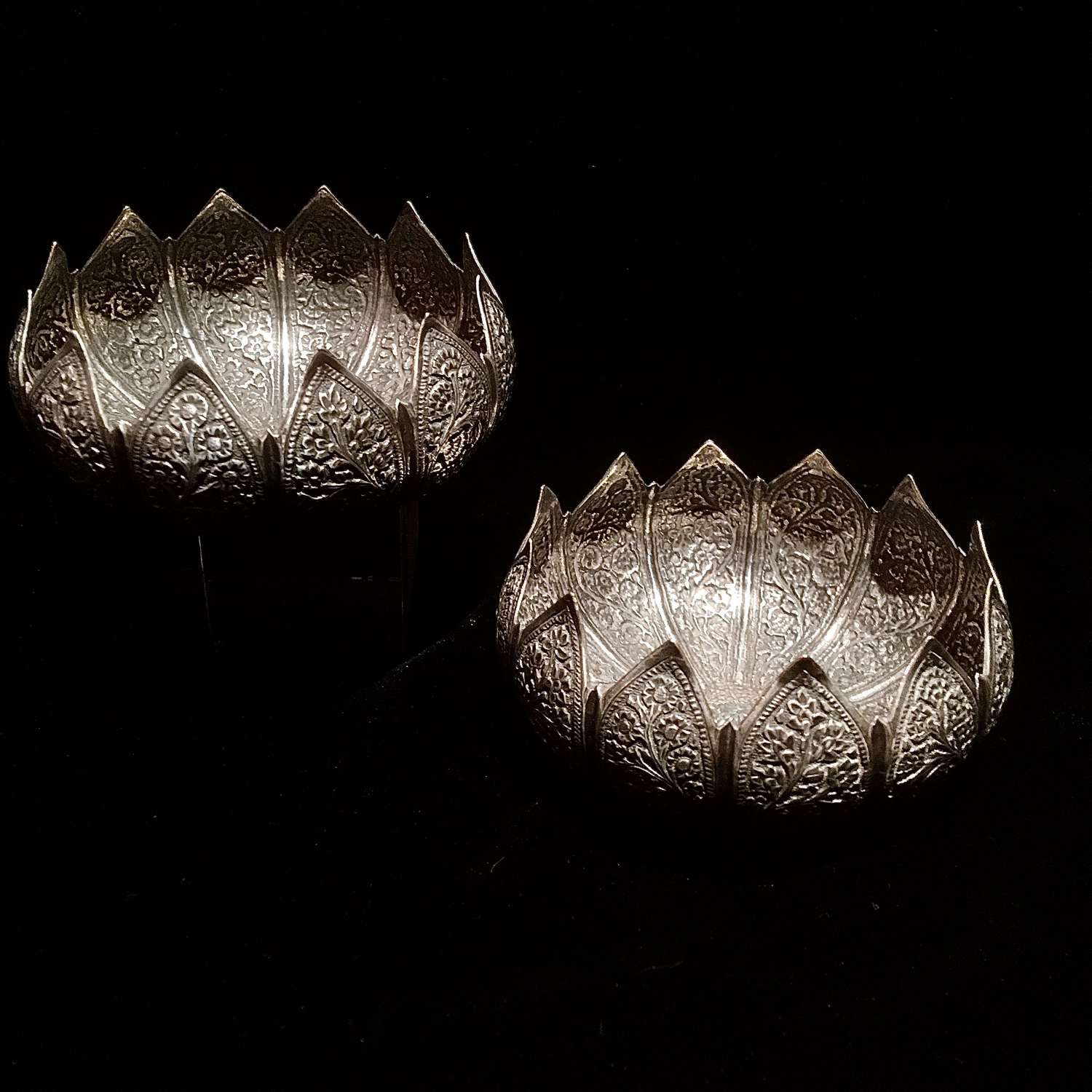 A beautiful pair of répoussé silver bowls in the form of lotus flowers