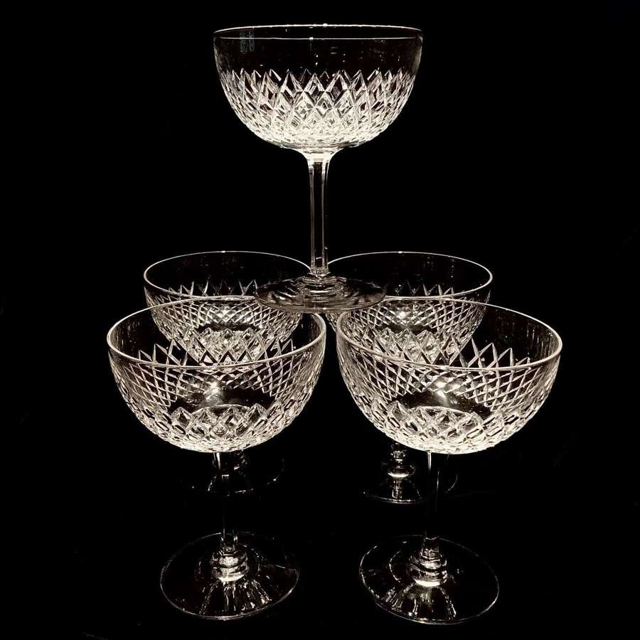 A set of five (5) matching cut crystal champagne, coupes or boats