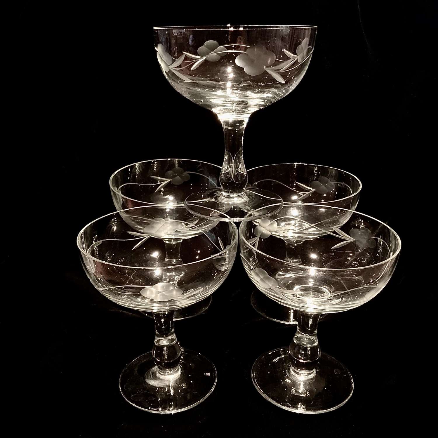 A set of five (5) matching cut crystal champagne, coupes or boats