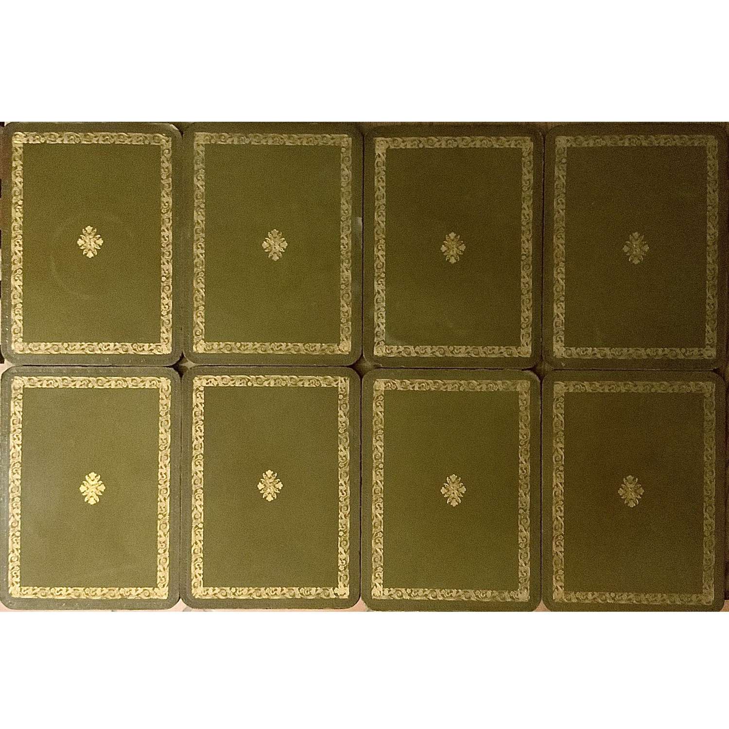 A Set of Eight (8) Vintage Tooled Olive Green Leather Table Place Mats