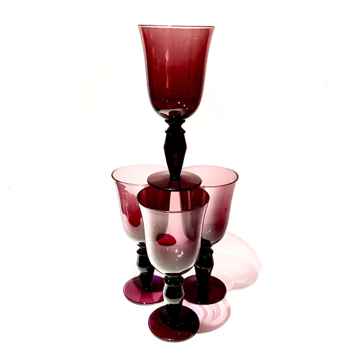 An Attractive Set of Four (4) Amethyst Coloured Glass Goblets