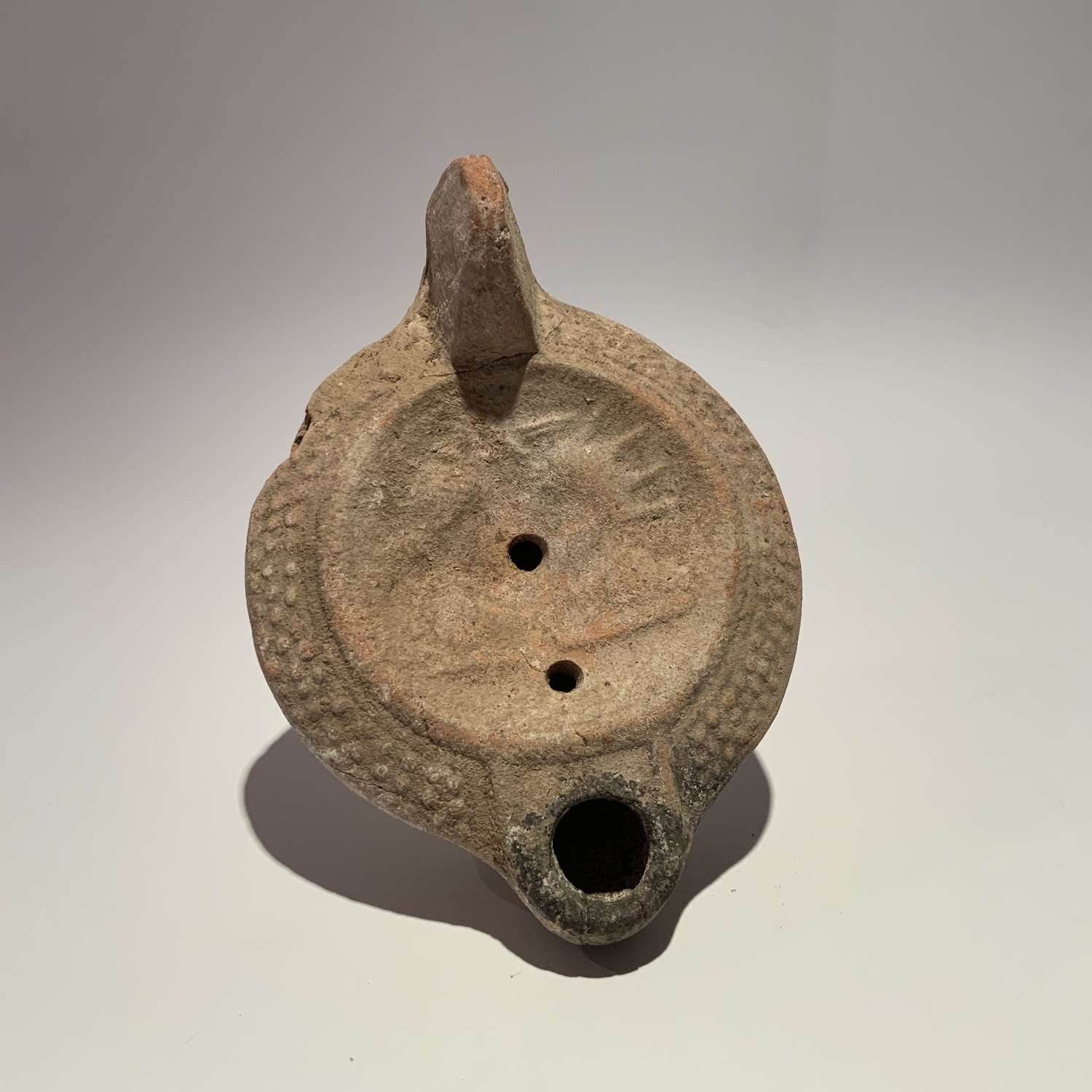 Ancient Terracotta Oil Lamp Decorated With Busts of Serapis and Isis