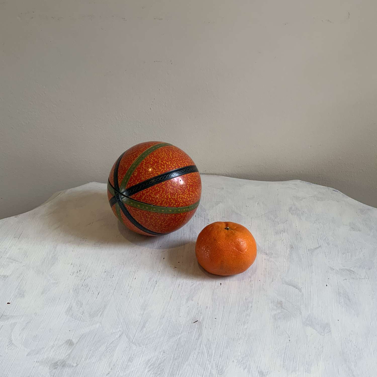 An Indian Orange Lacquer Turned Wood Stacking Nesting Ball Puzzle
