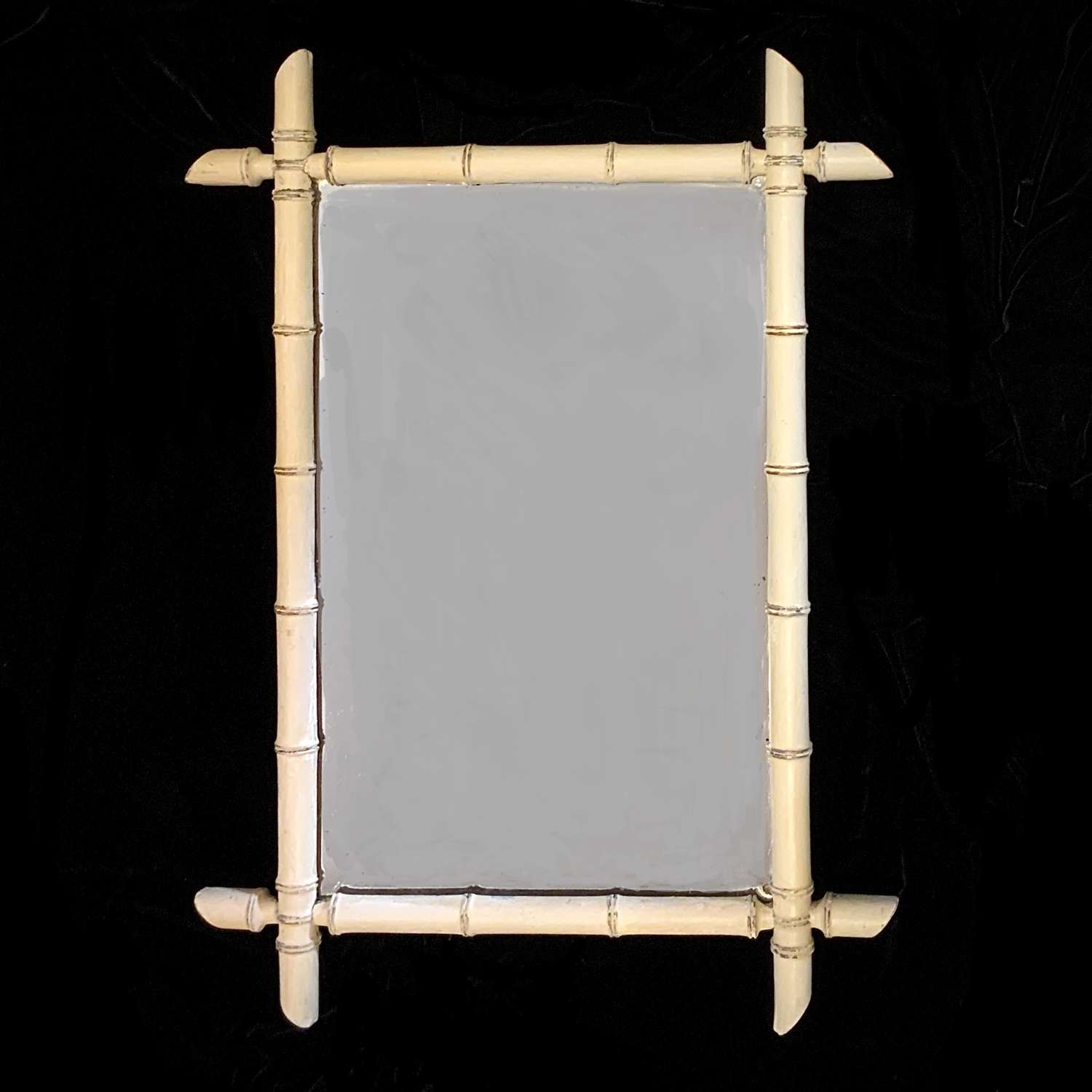 An Antique Cream Painted Faux Bamboo Wall Mirror of Good Size