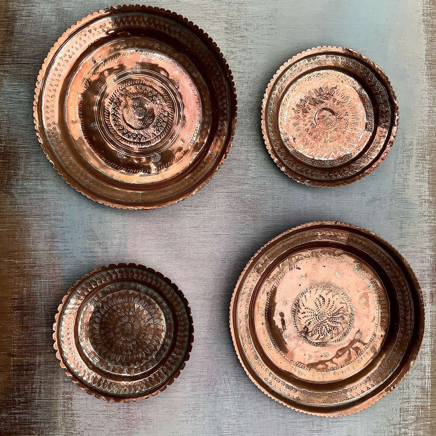 A Set of Four Indo-Persian Tinned Copper Wall-Hanging Plates